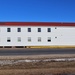 Contractors moving four World War II-era barracks buildings at Fort McCoy