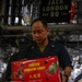 Sailors Move Supplies In a Working Party Aboard USS Oakland