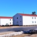 Contractors moving four World War II-era barracks buildings at Fort McCoy