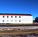 Contractors moving four World War II-era barracks buildings at Fort McCoy