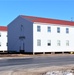 Contractors moving four World War II-era barracks buildings at Fort McCoy