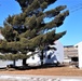 Contractors moving four World War II-era barracks buildings at Fort McCoy