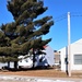 Contractors moving four World War II-era barracks buildings at Fort McCoy