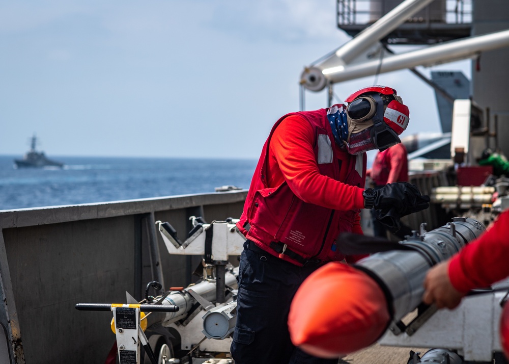 Sailor Inspects Ordnance