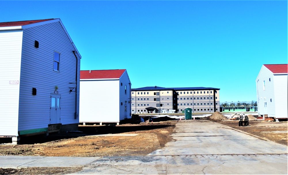 Contractors moving four World War II-era barracks buildings at Fort McCoy