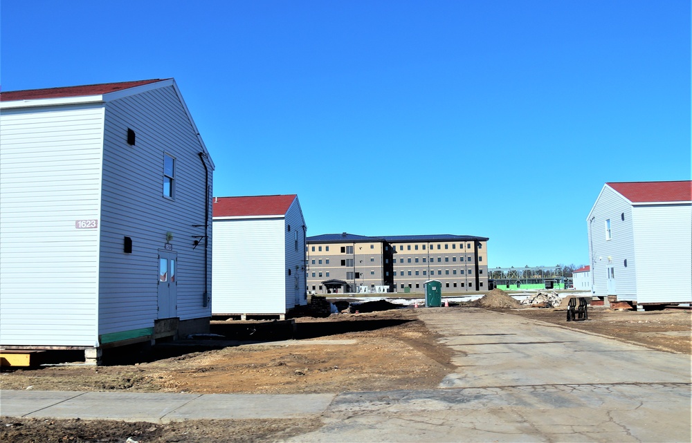 Contractors moving four World War II-era barracks buildings at Fort McCoy