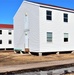 Contractors moving four World War II-era barracks buildings at Fort McCoy