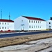 Contractors moving four World War II-era barracks buildings at Fort McCoy