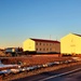 Contractors moving four World War II-era barracks buildings at Fort McCoy