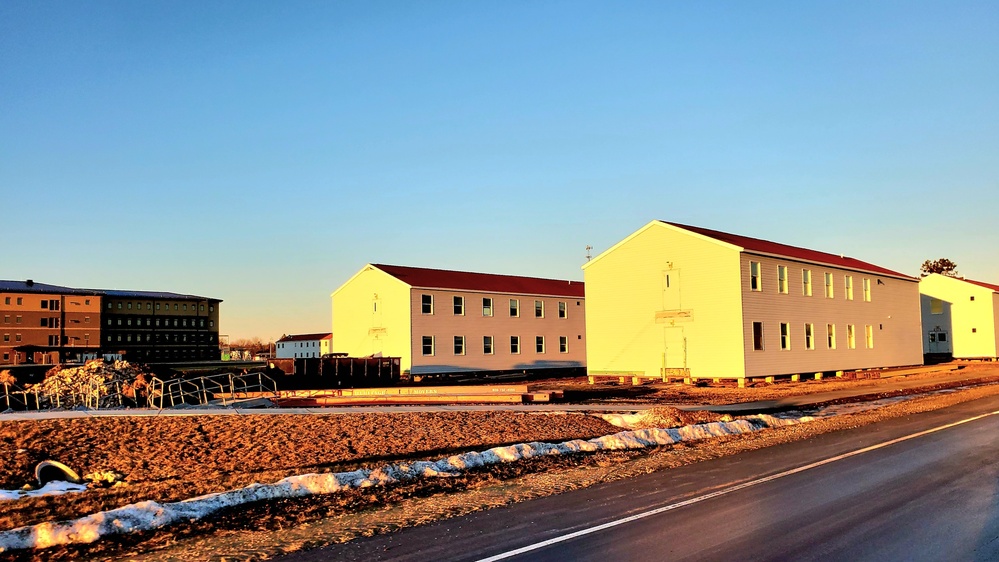 Contractors moving four World War II-era barracks buildings at Fort McCoy