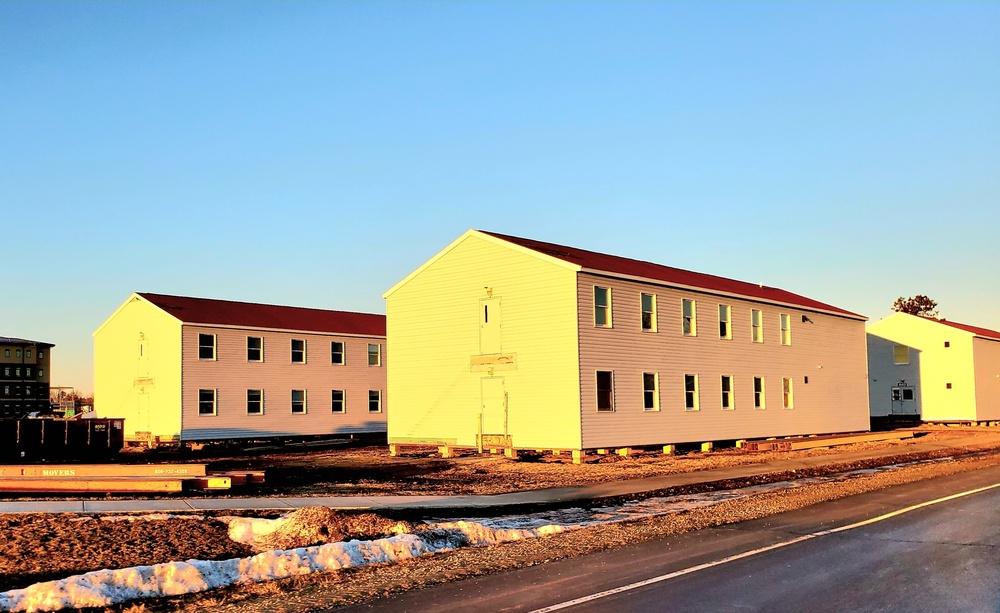 Contractors moving four World War II-era barracks buildings at Fort McCoy