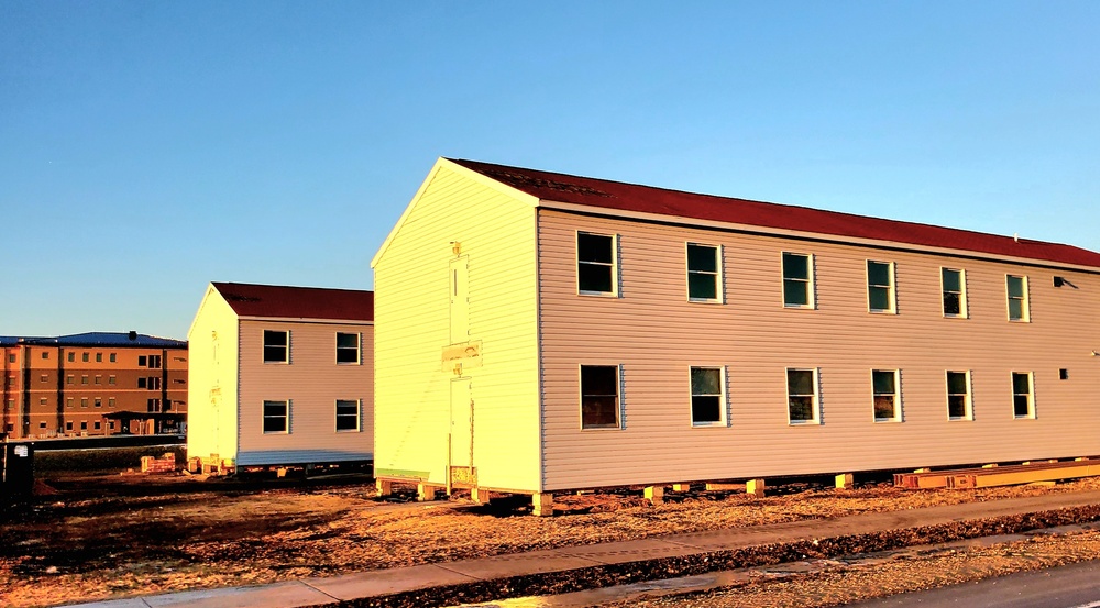 Contractors moving four World War II-era barracks buildings at Fort McCoy