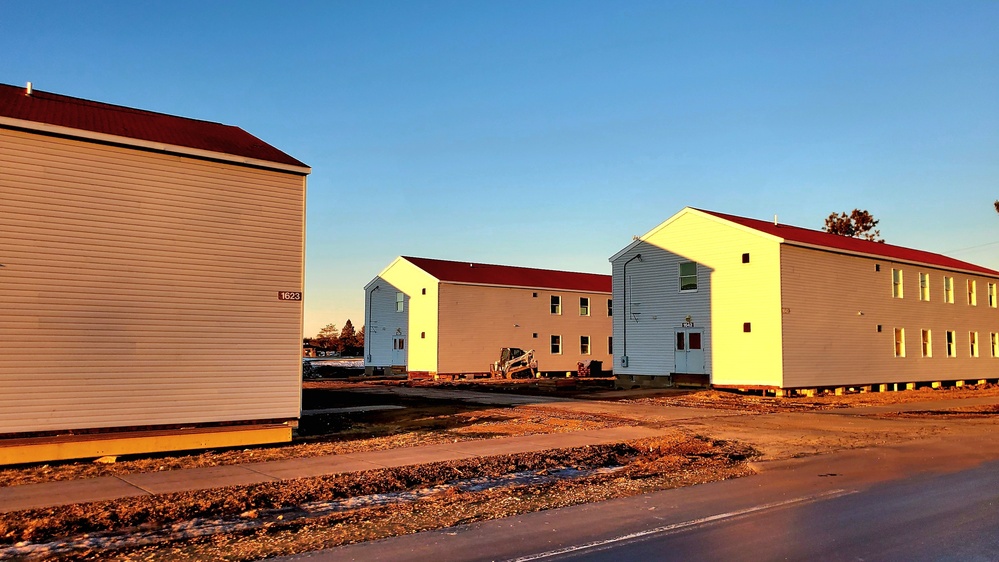 Contractors moving four World War II-era barracks buildings at Fort McCoy