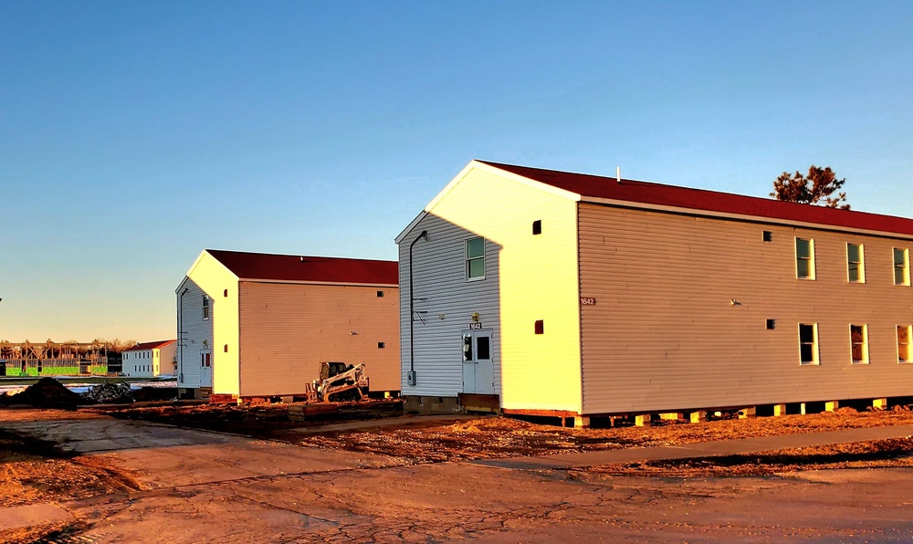 Contractors moving four World War II-era barracks buildings at Fort McCoy