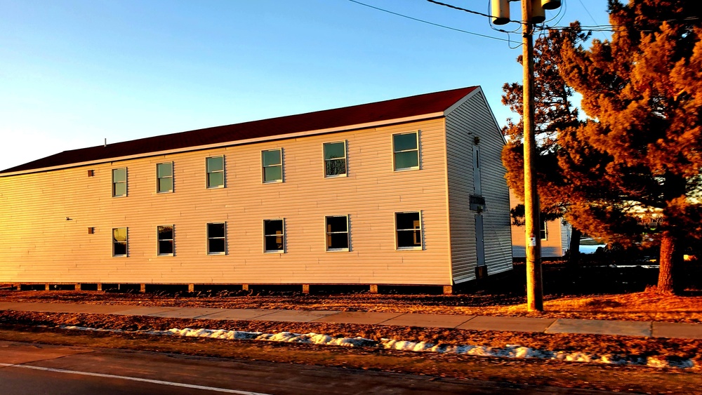 Contractors moving four World War II-era barracks buildings at Fort McCoy