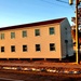 Contractors moving four World War II-era barracks buildings at Fort McCoy