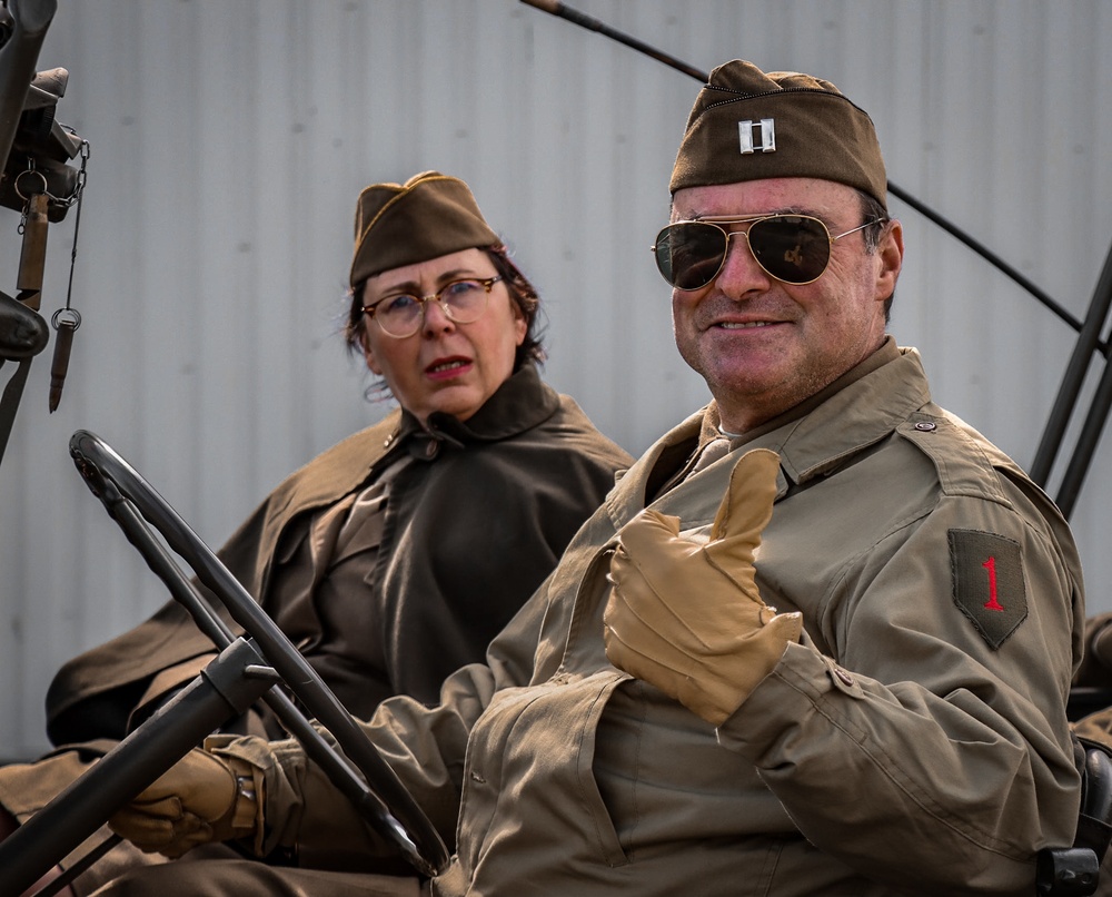 Soldiers and civilians gather at Airstrip to welcome D-Day Veterans