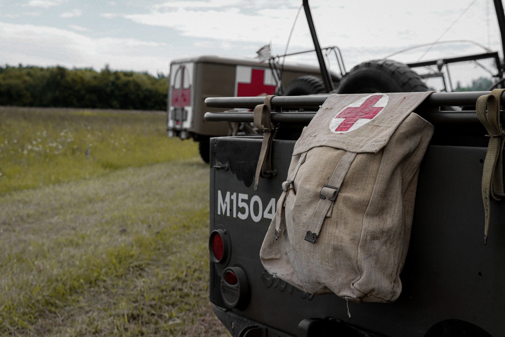 Soldiers and civilians gather at Airstrip to welcome D-Day Veterans