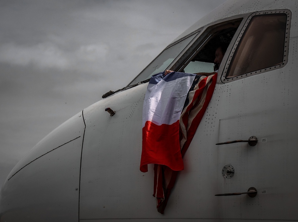 Soldiers and civilians gather at Airstrip to welcome D-Day Veterans