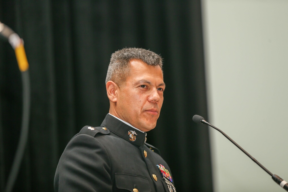 Lt Col. Daniel Sanchez the 8th Marine Corps District Executive Officer addresses the new graduates and members of the School Superintendents Association.