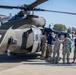 A US Army UH-60 Blackhawk is loaded with humanitarian aid supplies