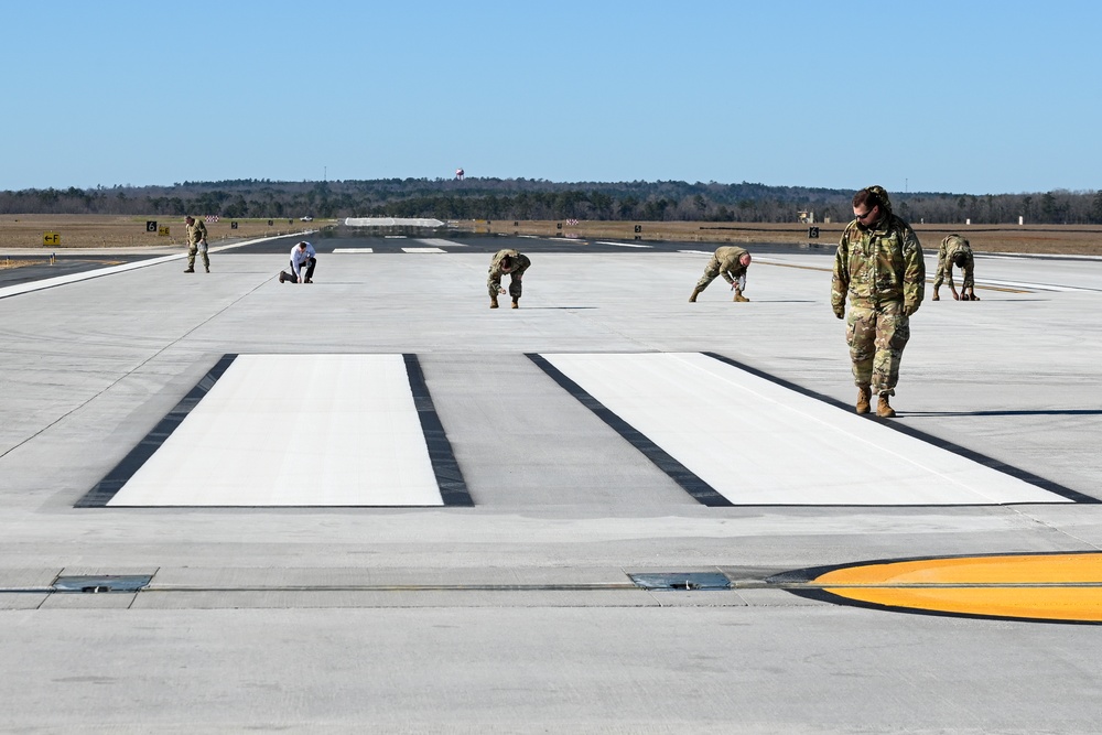 169th Fighter Wing Airmen conduct FOD walk on runway