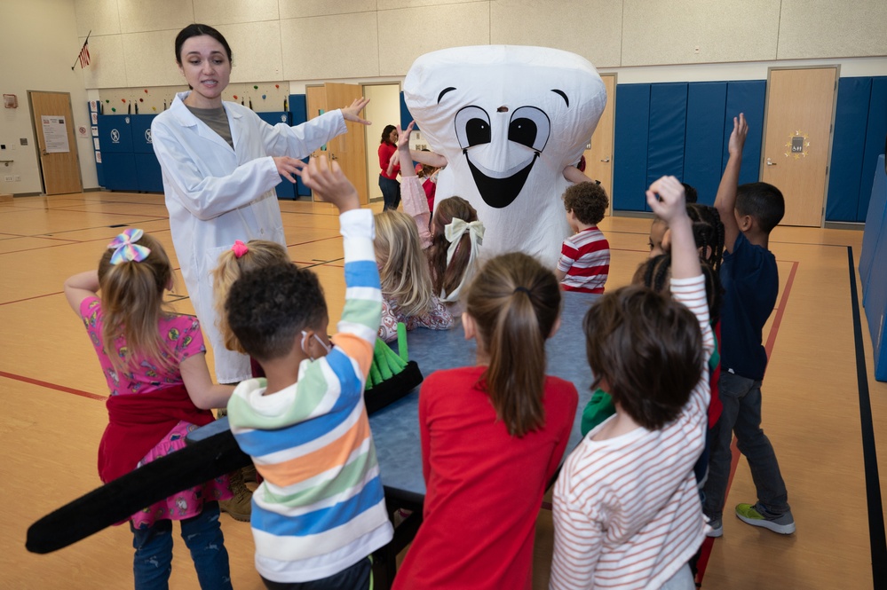 Hanscom dental clinic visits with students at primary school