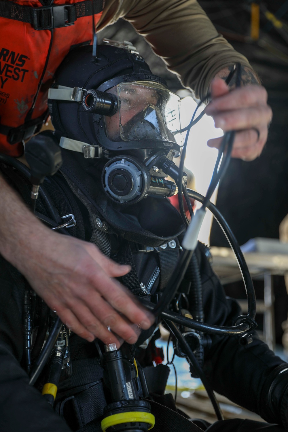 U.S. Navy Diver prepares to go ice diving in Little Falls, Minnesota