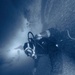 A U.S. Navy Explosive Ordnance Disposal (EOD) Technician Goes Ice Diving