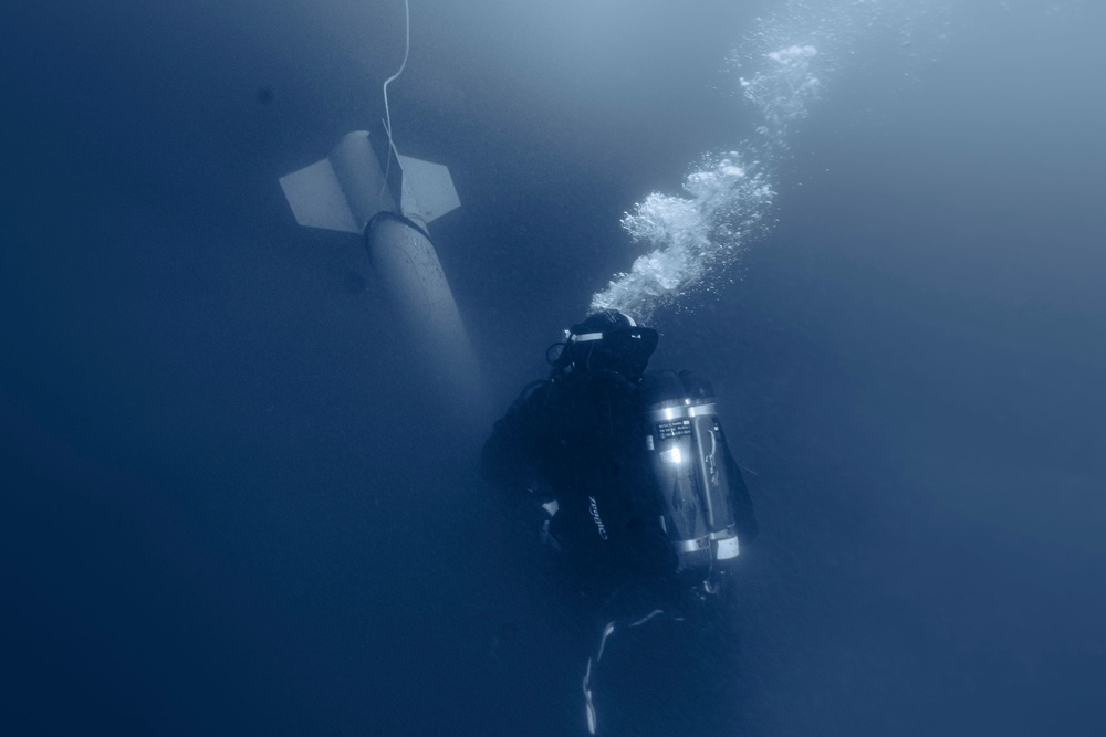 U.S. Navy Diver prepares goes ice diving in Little Falls, Minnesota