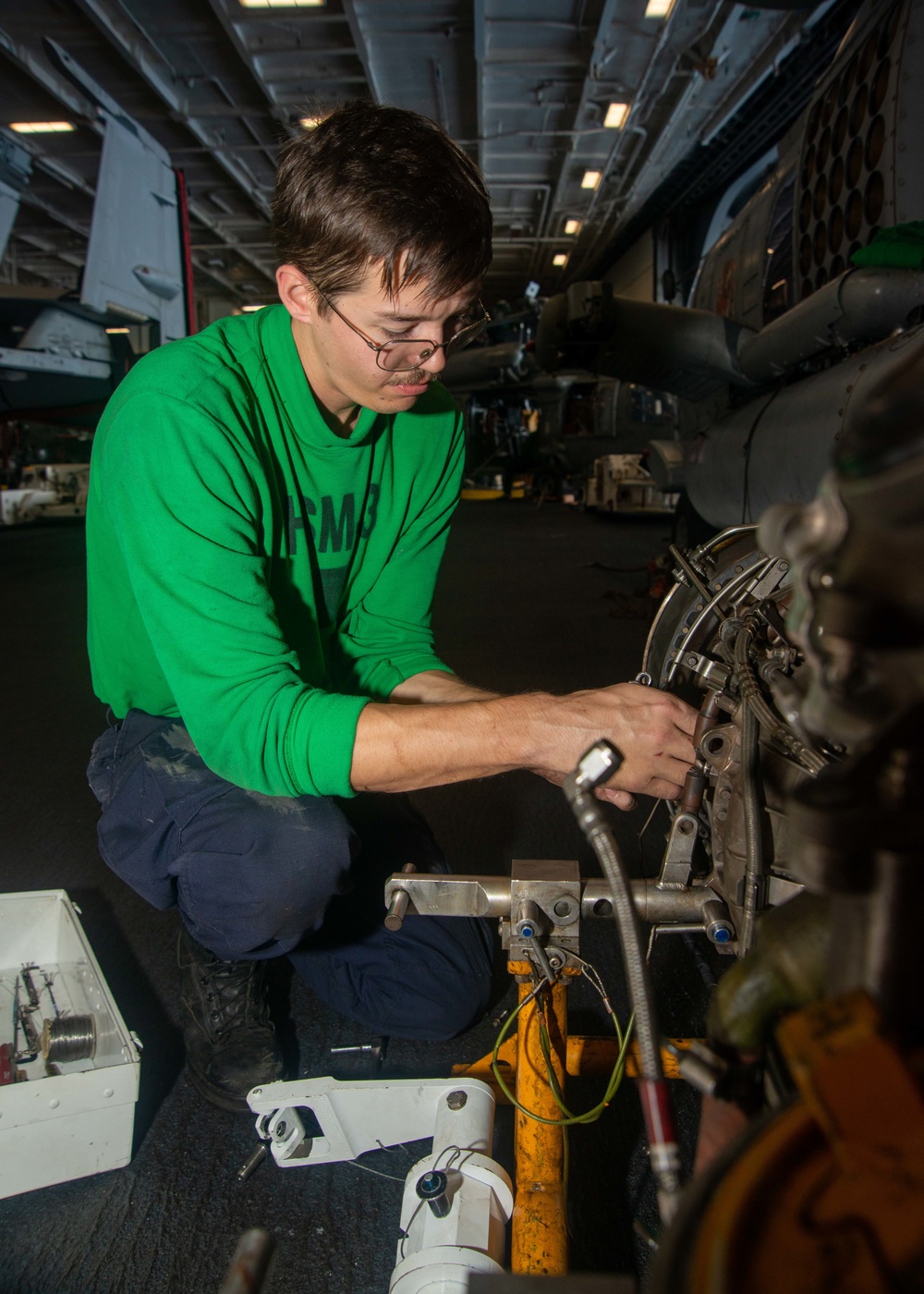 Sailor Removes Helicopter Engine Components