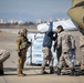 A US Army CH-47 Chinook is loaded with humanitarian aid supplies