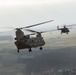 A U.S. CH-47 Chinook and a Polish MI-17 helicopter fly together during Rotor 23'