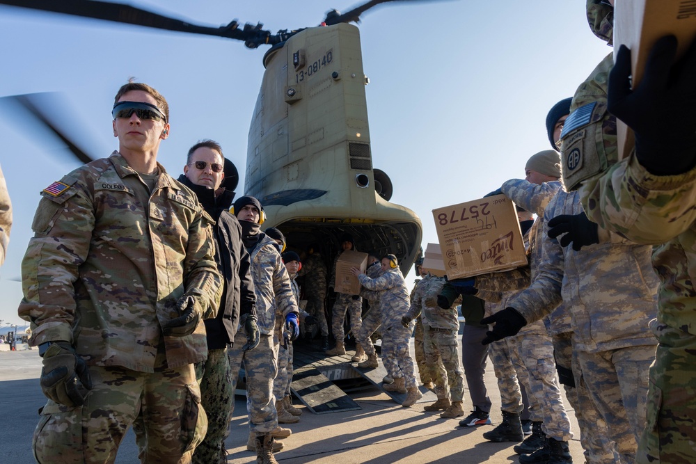 A US Army CH-47 Chinook is loaded with humanitarian aid supplies