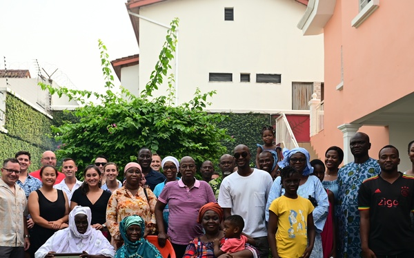 Members of USCGC Spencer (WMEC 905) celebrate Ensign Mohammad Diakite’s homecoming at his family’s home in Côte d’Ivoire