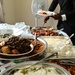 Members of USCGC Spencer (WMEC 905) celebrate Ensign Mohammad Diakite’s homecoming at his family’s home in Côte d’Ivoire