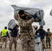 A US Army CH-47 Chinook is loaded with humanitarian aid supplies