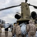 A US Army CH-47 Chinook is loaded with humanitarian aid supplies