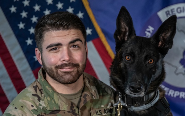 Military working dog and his handler pose for photo