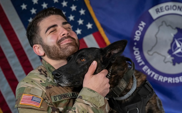 Military working dog and his handler pose for photo