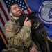 Military working dog and his handler pose for photo