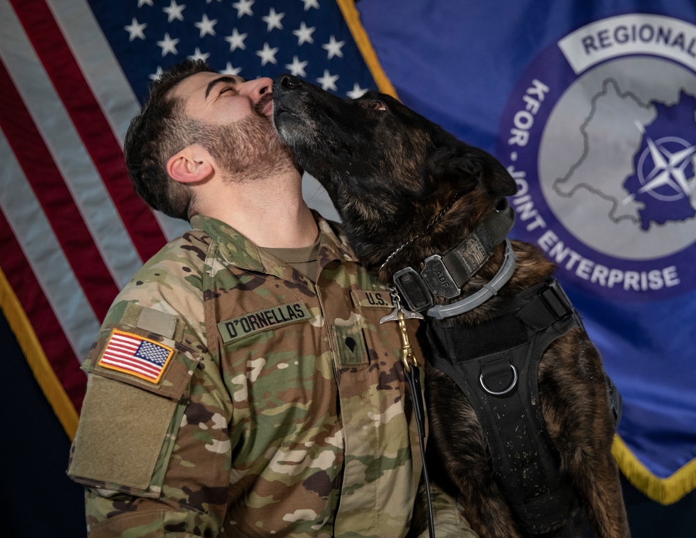 Military working dog and his handler pose for photo