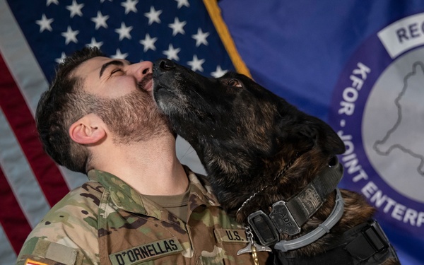 Military working dog and his handler pose for photo