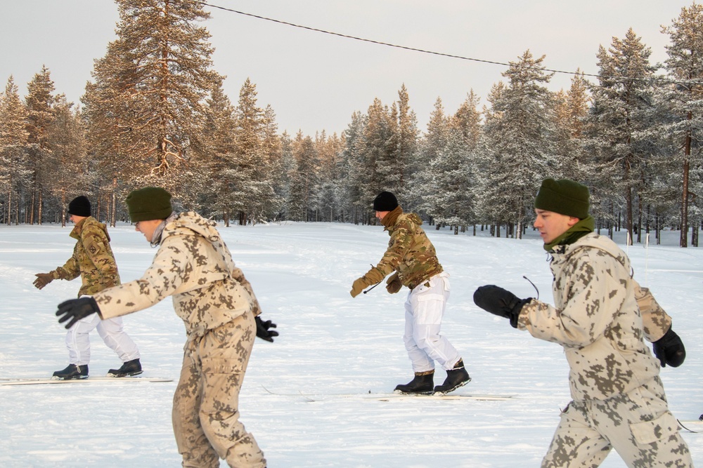 Charlie Troop, 3-71 Cavalry Regiment, 1BCT, 10th Mountain Division train with Finnish soldiers on a ski obstacle course during Defense Exercise North in Sodankyla Garrison, Finland, during Exercise Arctic Forge '23 on Feb. 21, 2023