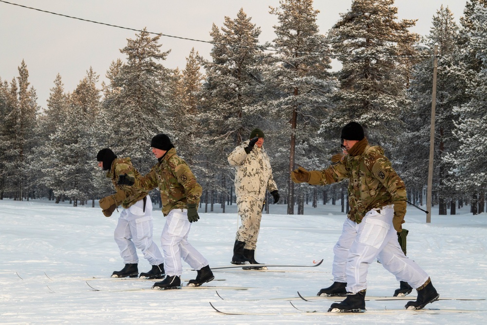 Charlie Troop, 3-71 Cavalry Regiment, 1BCT, 10th Mountain Division train with Finnish soldiers on a ski obstacle course during Defense Exercise North in Sodankyla Garrison, Finland, during Exercise Arctic Forge '23 on Feb. 21, 2023