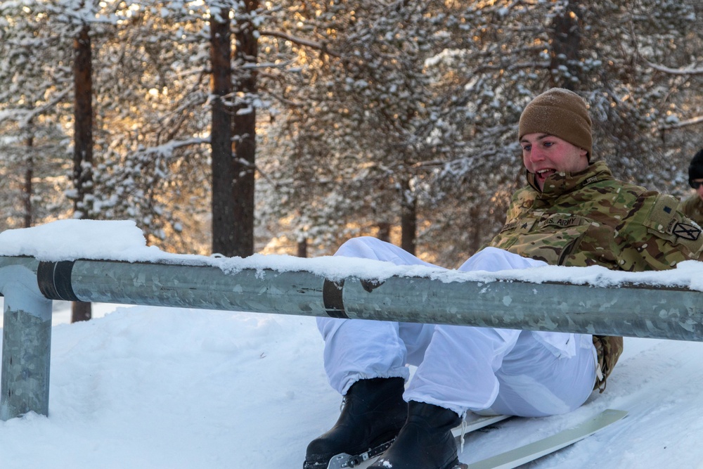 Charlie Troop, 3-71 Cavalry Regiment, 1BCT, 10th Mountain Division train with Finnish soldiers on a ski obstacle course during Defense Exercise North in Sodankyla Garrison, Finland, during Exercise Arctic Forge '23 on Feb. 21, 2023