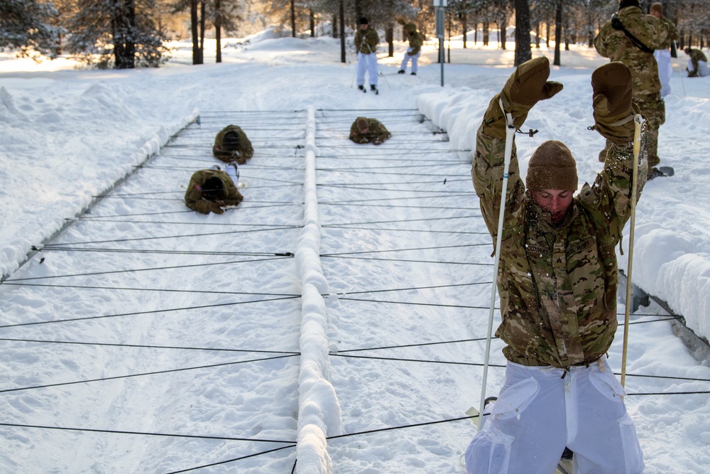 Charlie Troop, 3-71 Cavalry Regiment, 1BCT, 10th Mountain Division train with Finnish soldiers on a ski obstacle course during Defense Exercise North in Sodankyla Garrison, Finland, during Exercise Arctic Forge '23 on Feb. 21, 2023