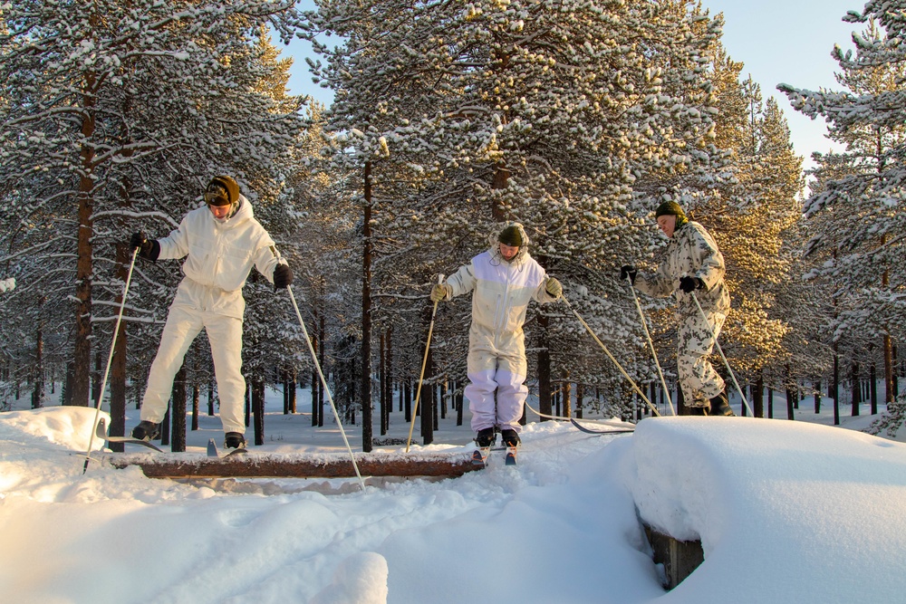 Charlie Troop, 3-71 Cavalry Regiment, 1BCT, 10th Mountain Division train with Finnish soldiers on a ski obstacle course during Defense Exercise North in Sodankyla Garrison, Finland, during Exercise Arctic Forge '23 on Feb. 21, 2023