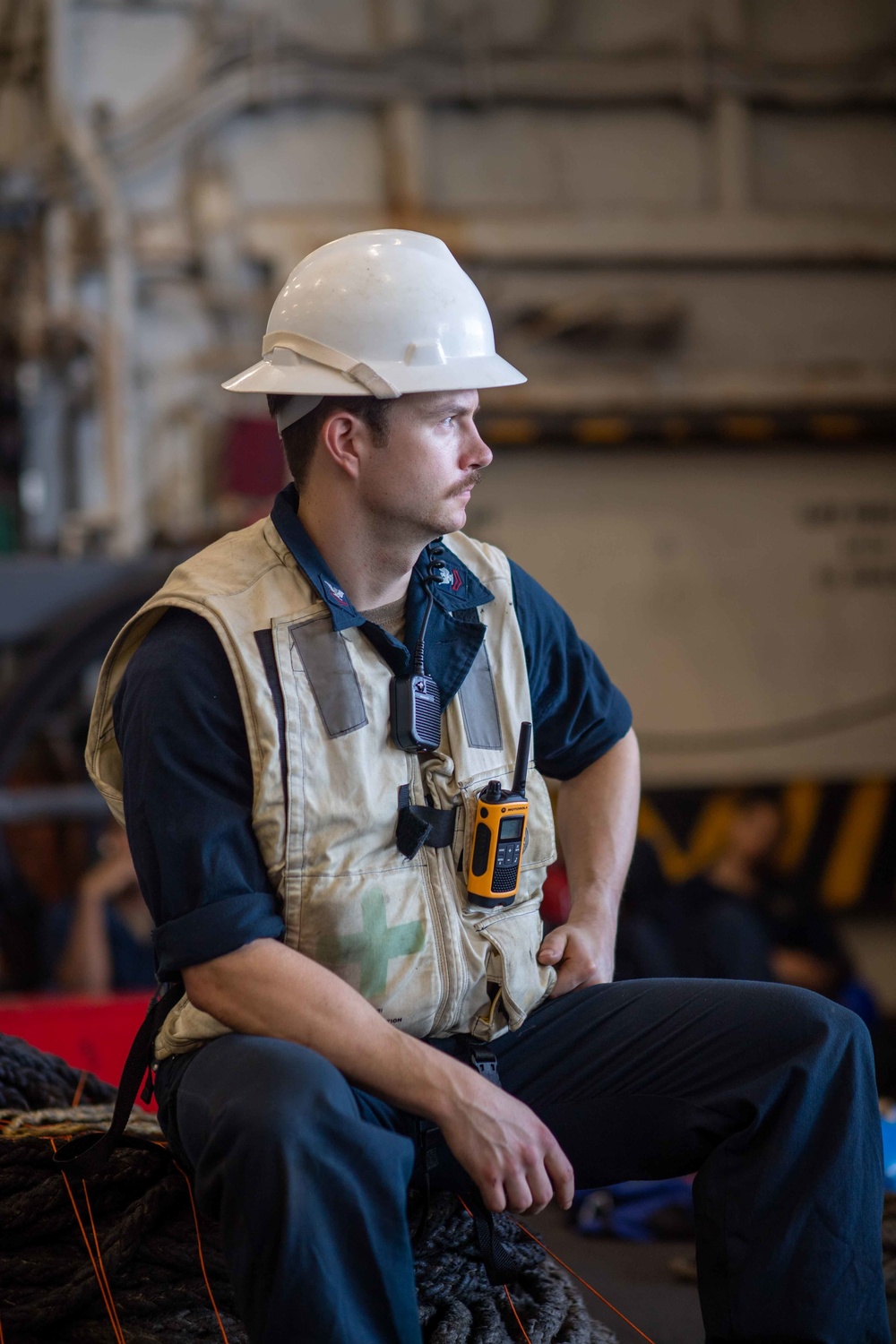 U.S. Navy Sailor Supervises Cargo Onload During A Replenishment-At-Sea