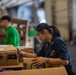 U.S. Navy Sailors Sort Mail During A Replenishment-At-Sea